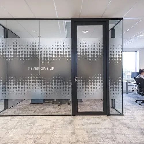 Alt="Frameless glass office partition installed in Clifton Karachi"